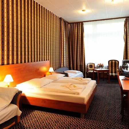 ซิตี้ โฮเทล อัม คูร์เฟือร์ชเตนดัม Hotel เบอร์ลิน ห้อง รูปภาพ