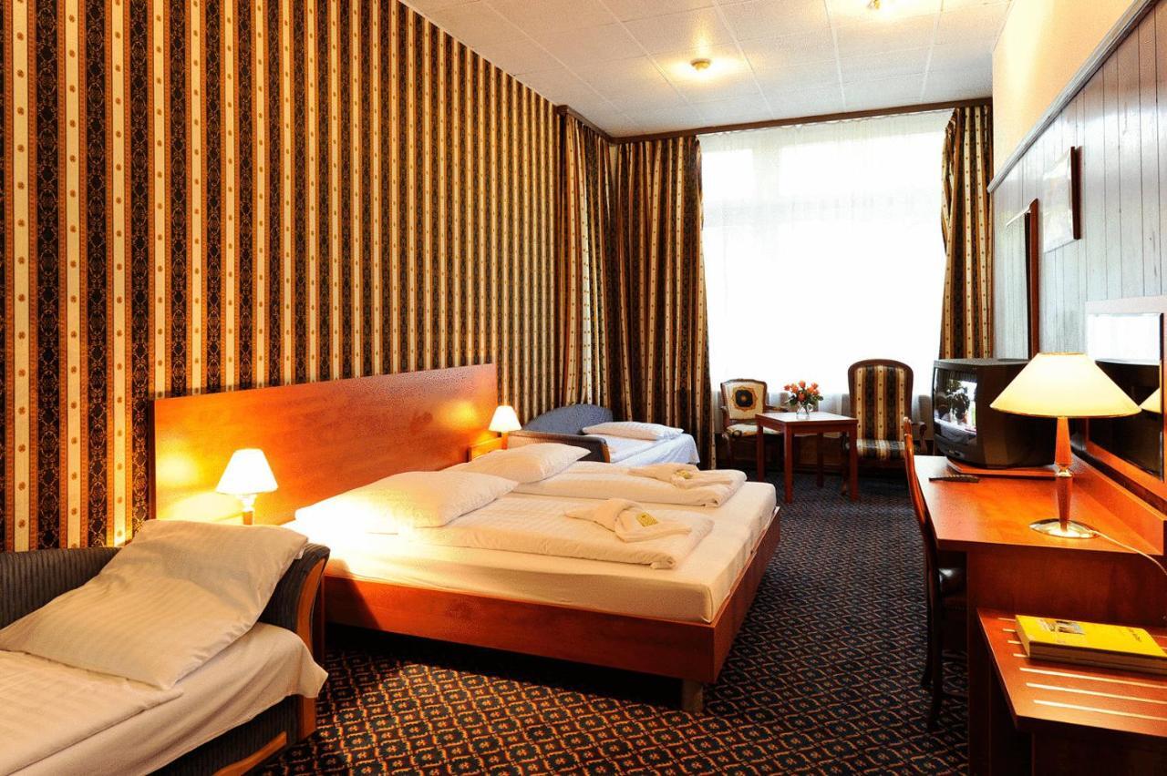 ซิตี้ โฮเทล อัม คูร์เฟือร์ชเตนดัม Hotel เบอร์ลิน ห้อง รูปภาพ